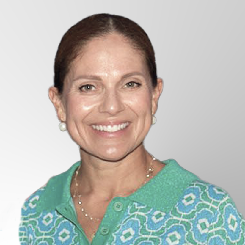 A woman with brown hair tied back smiles at the camera. She wears pearl earrings and a green patterned collared shirt. The background is a light gray gradient.