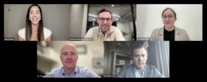 A virtual meeting with five professionally dressed people, each appearing in separate screens. Three men and two women are smiling or looking attentive, seated in well-lit indoor settings. Names and titles are visible on screen.