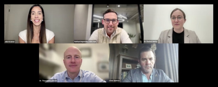 A virtual meeting with five professionally dressed people, each appearing in separate screens. Three men and two women are smiling or looking attentive, seated in well-lit indoor settings. Names and titles are visible on screen.